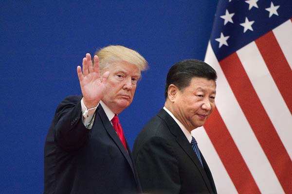 US President Donald Trump (L) and China's President Xi Jinping leave a business leaders event at the Great Hall of the People in Beijing on November 9, 2017. Donald Trump urged Chinese leader Xi Jinping to work "hard" and act fast to help resolve the North Korean nuclear crisis, during their meeting in Beijing on November 9, warning that "time is quickly running out". / AFP PHOTO / Nicolas ASFOURI (Photo credit should read NICOLAS ASFOURI/AFP/Getty Images)
